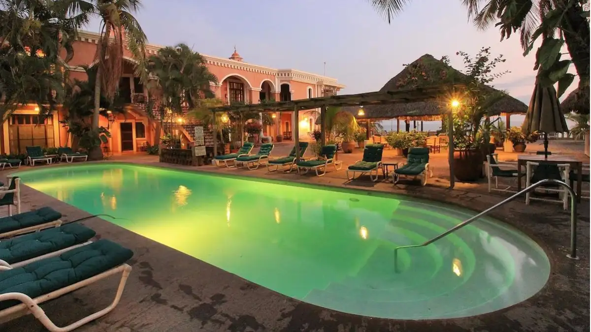 Pool area at dusk at the Hotel Santa Fe Puerto Escondido in Mexico